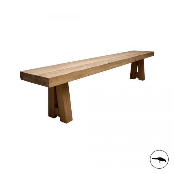 solid oak dining bench. Bespoke. Chunky. A shape legs. Beam. Light tone wood. Space saving dining seating.